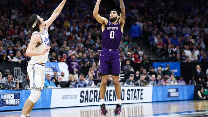 Mar 18, 2023; Sacramento, CA, USA; Northwestern Wildcats guard Boo Buie (0) attempts a three pointer while defended by UCLA Bruins guard Jaime Jaquez Jr. (24) during the second half at Golden 1 Center. Mandatory Credit: Kelley L Cox-USA TODAY Sports