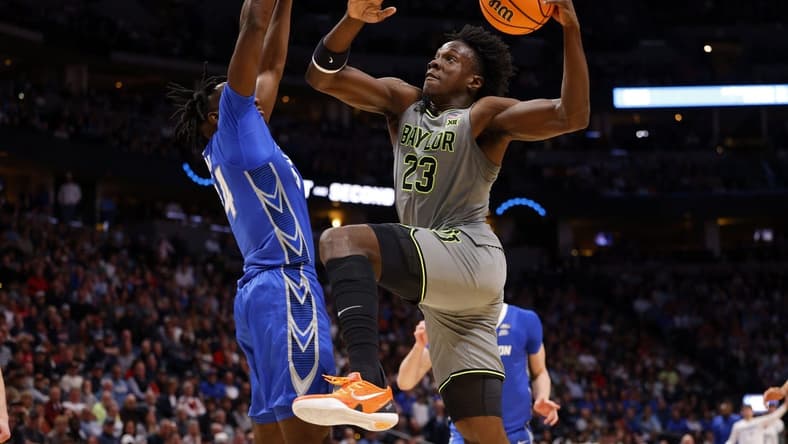 Mar 19, 2023; Denver, CO, USA; Baylor Bears forward Jonathan Tchamwa Tchatchoua (23) shoots against Creighton Bluejays forward Arthur Kaluma (24) in the second half at Ball Arena. Mandatory Credit: Michael Ciaglo-USA TODAY Sports