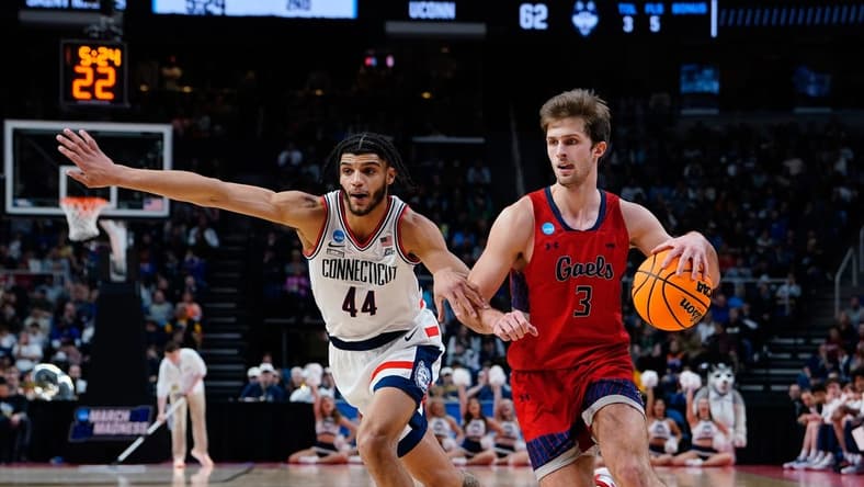 Mar 19, 2023; Albany, NY, USA; Saint Mary's Gaels guard Augustas Marciulionis (3) dribbles the ball against Connecticut Huskies guard Andre Jackson Jr. (44) during the second half at MVP Arena. Mandatory Credit: Gregory Fisher-USA TODAY Sports