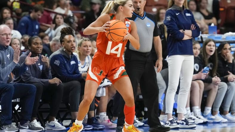 Mar 24, 2023; Greenville, SC, USA; Miami Hurricanes guard Haley Cavinder (14) looks for an open teammate against the Villanova Wildcats during the NCAA Women   s Tournament at Bon Secours Wellness Arena. Mandatory Credit: Jim Dedmon-USA TODAY Sports