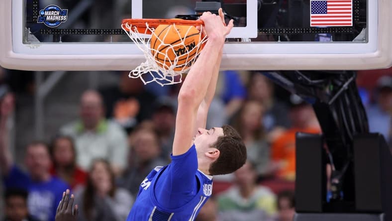Mar 26, 2023; Louisville, KY, USA;  Creighton Bluejays center Ryan Kalkbrenner (11) dunks the ball during the second half against the San Diego State Aztecs at the NCAA Tournament South Regional-Creighton vs San Diego State at KFC YUM! Center. Mandatory Credit: Jordan Prather-USA TODAY Sports