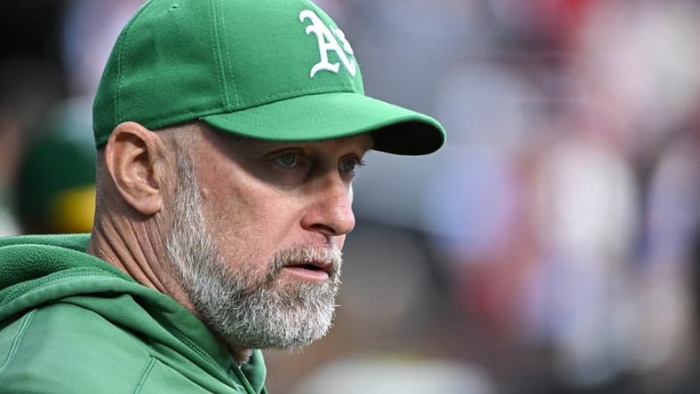 Aug 15, 2023; St. Louis, Missouri, USA; Oakland Athletics manager Mark Kotsay (7) looks on from the dugout before a game against the St. Louis Cardinals at Busch Stadium. Mandatory Credit: Jeff Curry-USA TODAY Sports