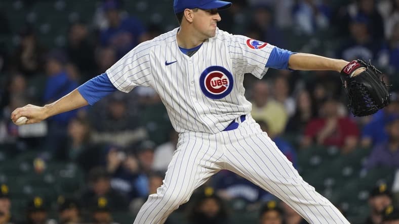 Sep 21, 2023; Chicago, Illinois, USA; Chicago Cubs starting pitcher Kyle Hendricks (28) throws the ball against the Pittsburgh Pirates during the first inning at Wrigley Field. Mandatory Credit: David Banks-USA TODAY Sports