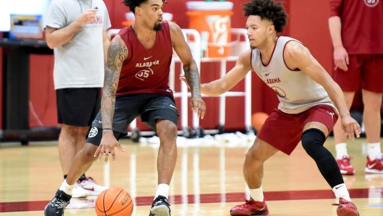 Alabama guard Aaron Estrada dribbles the ball with Alabama guard Mark Sears (1) defending during practice for the Crimson Tide Men   s Basketball team Monday, Sept. 25, 2023.
