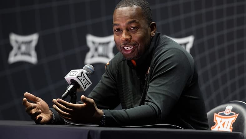 Oct 18, Kansas City, MO, USA; Oklahoma State head coach Mike Boynton answers questions at the Big 12 Men s Basketball Tipoff at T-Mobile Center. Mandatory Credit: Kylie Graham-USA TODAY Sports