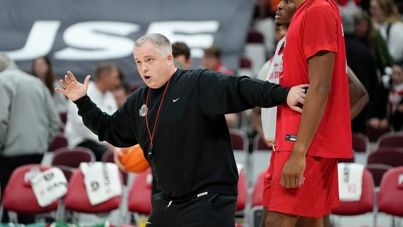 Oct 19, 2023; Columbus, Ohio, USA; Ohio State Buckeyes assistant coach Brandon Bailey works with Zed Key during an open practice at Value City Arena.