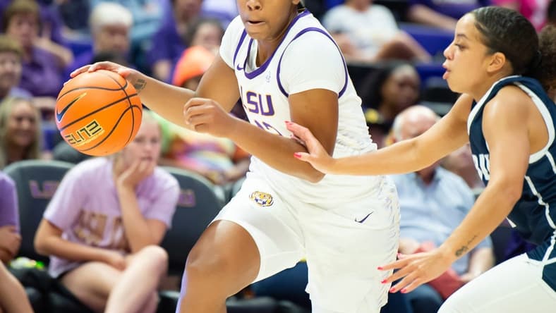 Mikaylah Williams (12) moves the ball as LSU Womens Basketball host East Texas Baptist. Thursday, Oct. 26, 2023.