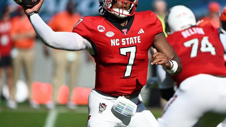 Oct 28, 2023; Raleigh, North Carolina, USA; North Carolina State Wolfpack quarterback MJ Morris (7) throws a pass during the first half against the Clemson Tigers at Carter-Finley Stadium. Mandatory Credit: Rob Kinnan-USA TODAY Sports