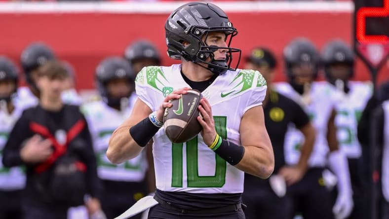 Oct 28, 2023; Salt Lake City, Utah, USA; Oregon Ducks quarterback Bo Nix (10) drops back to pass against the Utah Utes during the first half at Rice-Eccles Stadium. Mandatory Credit: Christopher Creveling-USA TODAY Sports