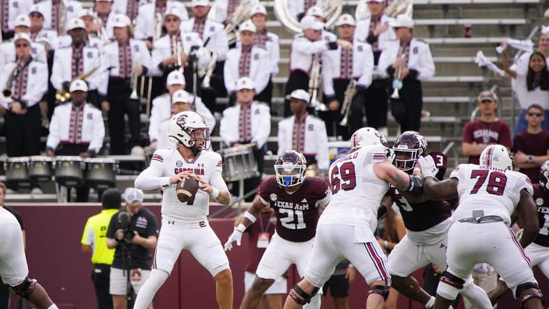 Oct 28, 2023; College Station, Texas, USA; South Carolina Gamecocks quarterback Spencer Rattler (7) looks for a pass against Texas A&M Aggies during the first quarter at Kyle Field. Mandatory Credit: Dustin Safranek-USA TODAY Sports