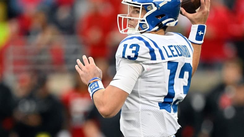 Oct 28, 2023; Louisville, Kentucky, USA; Duke Blue Devils quarterback Riley Leonard (13) looks to pass the ball against the Louisville Cardinals during the second half at L&N Federal Credit Union Stadium. Mandatory Credit: Jamie Rhodes-USA TODAY Sports