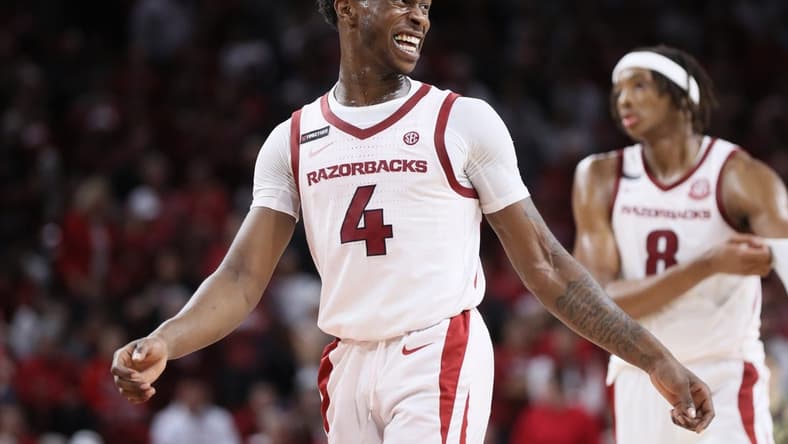 Oct 28, 2023; Fayetteville, AR, USA; Arkansas Razorbacks guard Davonte Davis (4) celebrates during the second half against the Purdue Boilermakers at Bud Walton Arena. Arkansas won 81-77. Mandatory Credit: Nelson Chenault-USA TODAY Sports