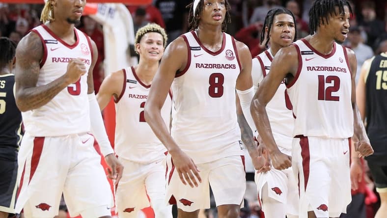 Oct 28, 2023; Fayetteville, AR, USA; Arkansas Razorbacks guard El Ellis (3) Khalif Battle (0) and guard Truman Mark (12) along with forward Trevon Brazil (2) and forward Chandler Lawson (8) celebrate after a score against the Purdue Boilermakers at Bud Walton Arena. Arkansas won 81-77. Mandatory Credit: Nelson Chenault-USA TODAY Sports