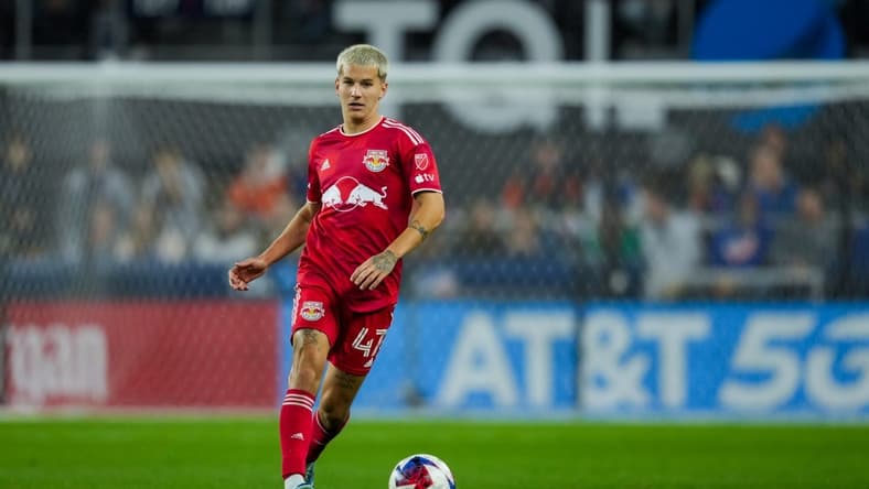 Oct 29, 2023; Cincinnati, OH, USA; New York Red Bulls defender John Tolkin (47) dribbles the ball against FC Cincinnati in the second half of game one in a round one match of the 2023 MLS Cup Playoffs at TQL Stadium. Mandatory Credit: Aaron Doster-USA TODAY Sports
