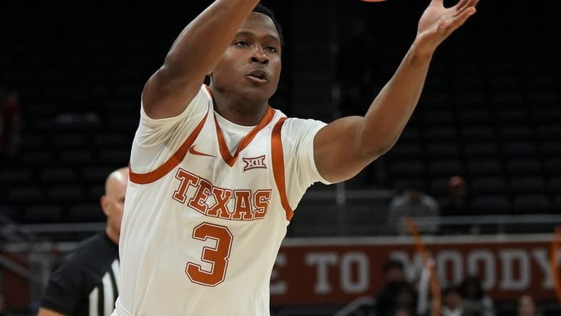 Texas Longhorns guard Max Abmas (3) passes to a teammate during a scrimmage against St. Edward's University on Monday, Oct. 30, 2023.