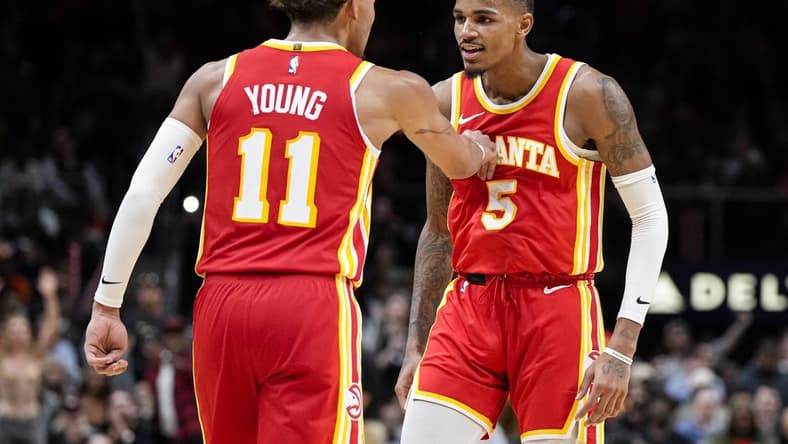 Oct 30, 2023; Atlanta, Georgia, USA; Atlanta Hawks guards Trae Young (11) and Dejounte Murray (5) react after a basket against the Minnesota Timberwolves during the second half at State Farm Arena. Mandatory Credit: Dale Zanine-USA TODAY Sports