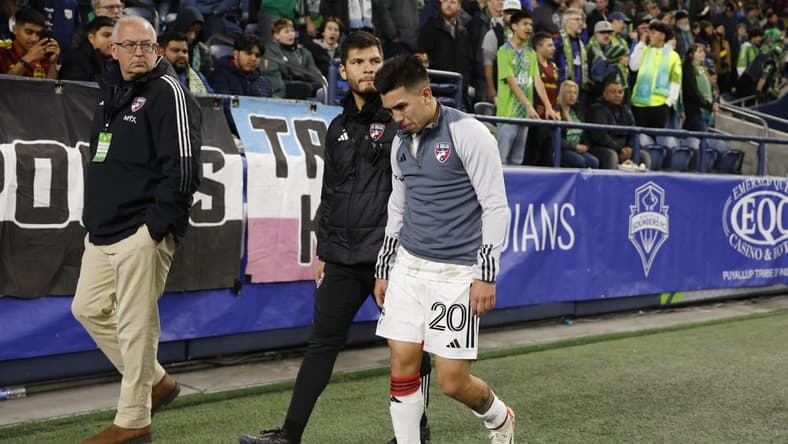 Oct 30, 2023; Seattle, Washington, USA; FC Dallas midfielder Alan Velasco (20) leaves the field after being injured in the first half against the Seattle Sounders FC in game one of a round one match of the 2023 MLS Cup Playoffs at Lumen Field. Mandatory Credit: Joe Nicholson-USA TODAY Sports