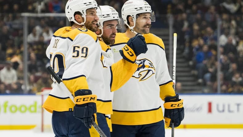 Oct 31, 2023; Vancouver, British Columbia, CAN; Nashville Predators defenseman Roman Josi (59) and defenseman Dante Fabbro (57) and forward Filip Forsberg (9) celebrate Fabbro s goal against the Vancouver Canucks in the first period at Rogers Arena. Mandatory Credit: Bob Frid-USA TODAY Sports