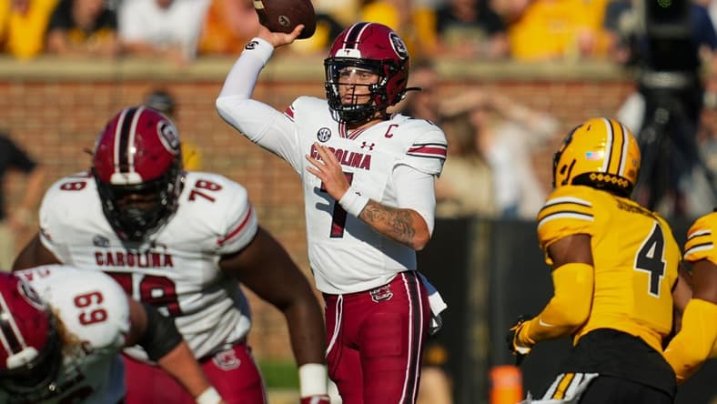 Oct 21, 2023; Columbia, Missouri, USA; South Carolina Gamecocks quarterback Spencer Rattler (7) throws a pass during the first half against the Missouri Tigers at Faurot Field at Memorial Stadium. Mandatory Credit: Jay Biggerstaff-USA TODAY Sports