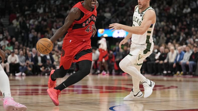 Nov 1, 2023; Toronto, Ontario, CAN; Toronto Raptors forward Pascal Siakam (43) drives to the net past Milwaukee Bucks guard Pat Connaughton (24) during the first half at Scotiabank Arena. Mandatory Credit: John E. Sokolowski-USA TODAY Sports