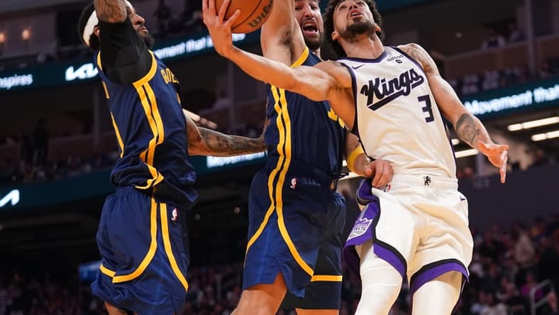 Nov 1, 2023; San Francisco, California, USA; Sacramento Kings guard Chris Duarte (3) is fouled by Golden State Warriors guard Klay Thompson (11) in the second quarter at the Chase Center. Mandatory Credit: Cary Edmondson-USA TODAY Sports.
