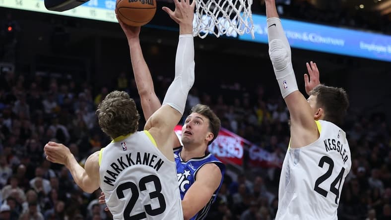 Nov 2, 2023; Salt Lake City, Utah, USA; Orlando Magic forward Franz Wagner (22) goes to the basket against Utah Jazz forward LauriMarkkanen (23) and center Walker Kessler (24) in the second quarter at the Delta Center. Mandatory Credit: Rob Gray-USA TODAY Sports