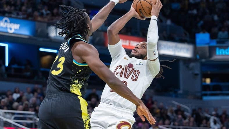 Nov 3, 2023; Indianapolis, Indiana, USA; Cleveland Cavaliers guard Darius Garland (10) shoots while Indiana Pacers forward Aaron Nesmith (23) defends in the second half at Gainbridge Fieldhouse. Mandatory Credit: Trevor Ruszkowski-USA TODAY Sports