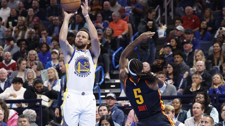 Nov 3, 2023; Oklahoma City, Oklahoma, USA; Golden State Warriors guard Stephen Curry (30) shoots a thee point basket against Oklahoma City Thunder guard Luguentz Dort (5) during the second half at Paycom Center. Mandatory Credit: Alonzo Adams-USA TODAY Sports