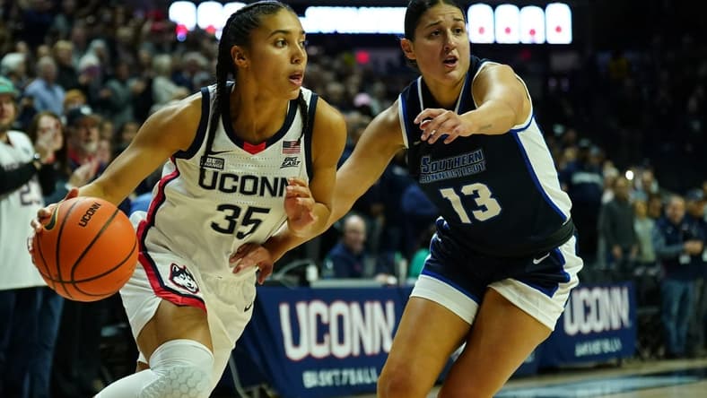 Nov 4, 2023; Storrs, CT, USA; UConn Huskies guard Azzi Fudd (35) drives the ball against Southern Connecticut State University guard Julianna Bonilla (13) in the first half at Gampel Pavillion. Mandatory Credit: David Butler II-USA TODAY Sports