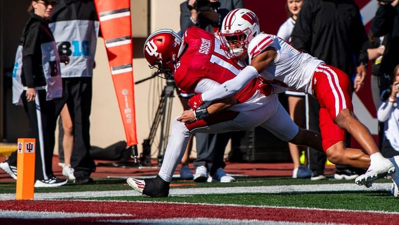 Nov 4, 2023; Bloomington, Indiana, USA; Indiana's Brendan Sorsby (15) scores a touchdown during the first half against Wisconsin at Memorial Stadium. Mandatory Credit: Rich Janzaruk-USA TODAY Sports