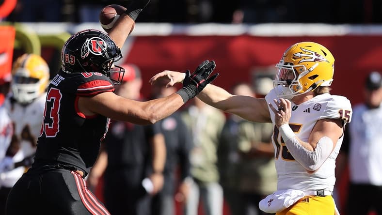 Nov 4, 2023; Salt Lake City, Utah, USA; Arizona State Sun Devils quarterback Jacob Conover (15) has pass deflected by Utah Utes defensive end Jonah Elliss (83) in the second quarter at Rice-Eccles Stadium. Mandatory Credit: Rob Gray-USA TODAY Sports