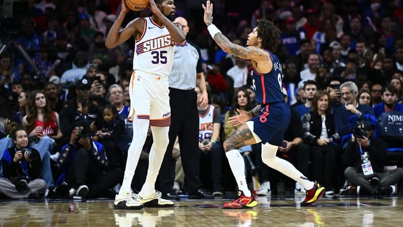 Nov 4, 2023; Philadelphia, Pennsylvania, USA; Phoenix Suns forward Kevin Durant (35) controls the ball against Philadelphia 76ers guard Kelly Oubre Jr (9) in the third quarter at Wells Fargo Center. Mandatory Credit: Kyle Ross-USA TODAY Sports
