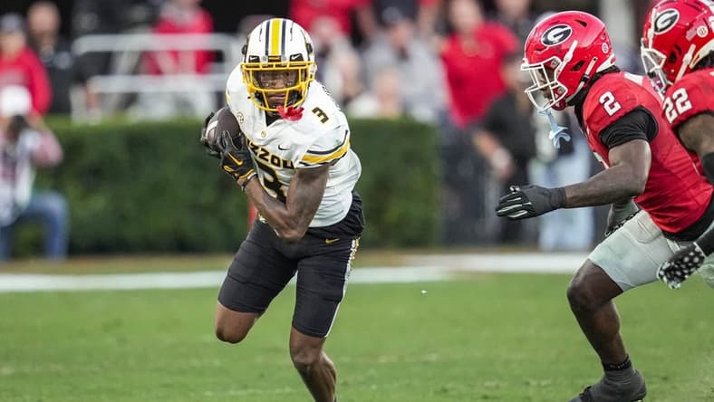 Nov 4, 2023; Athens, Georgia, USA; Missouri Tigers wide receiver Luther Burden III (3) runs against Georgia Bulldogs linebacker Smael Mondon Jr. (2) and defensive back Javon Bullard (22) during the second half at Sanford Stadium. Mandatory Credit: Dale Zanine-USA TODAY Sports