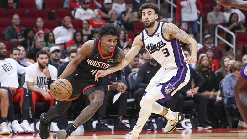 Nov 4, 2023; Houston, Texas, USA; Houston Rockets guard Jalen Green (4) drives with the ball as Sacramento Kings guard Chris Duarte (3) defends during the first quarter at Toyota Center. Mandatory Credit: Troy Taormina-USA TODAY Sports