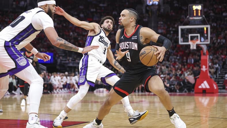 Nov 4, 2023; Houston, Texas, USA; Houston Rockets forward Dillon Brooks (9) steps back to shoot the ball as Sacramento Kings center JaVale McGee (00) defends during the second quarter at Toyota Center. Mandatory Credit: Troy Taormina-USA TODAY Sports