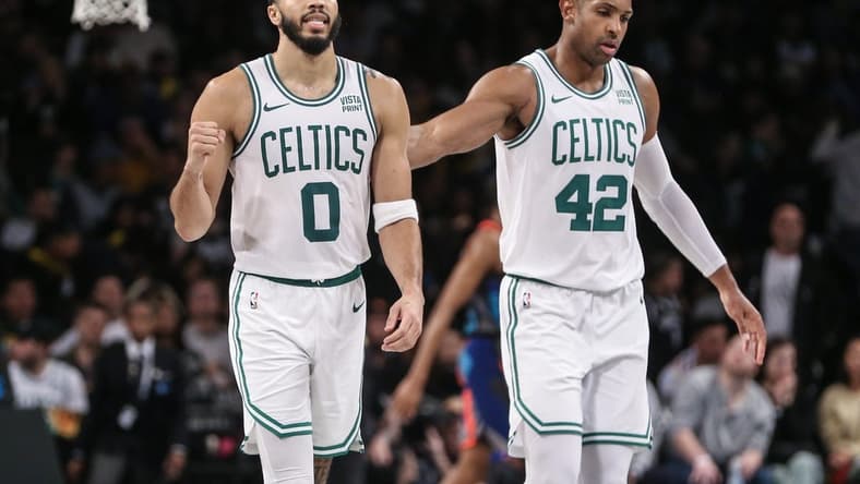 Nov 4, 2023; Brooklyn, New York, USA; Boston Celtics forward Jayson Tatum (0) and center Al Horford (42) walk back to the bench after the Brooklyn Nets call a time out in the fourth quarter at Barclays Center. Mandatory Credit: Wendell Cruz-USA TODAY Sports