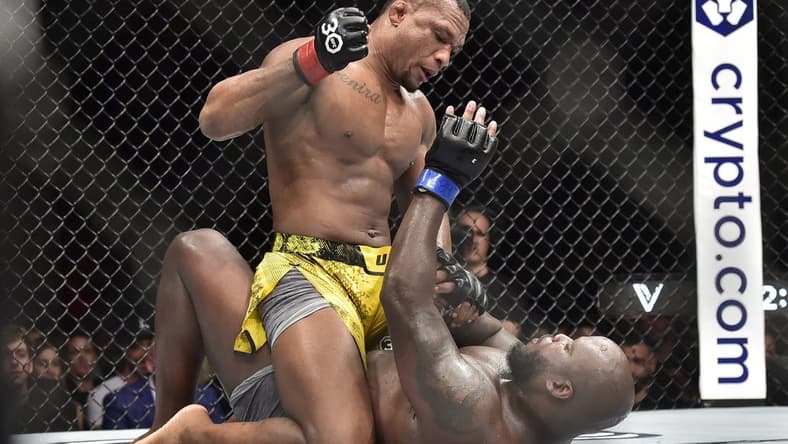 Nov 4, 2023; Sao Paulo, Brazil; Jailton Almeida (red gloves) fights Derrick Lewis (blue gloves) during UFC Fight Night at Ibirapuera Arena. Mandatory Credit: Jason da Silva-USA TODAY Sports