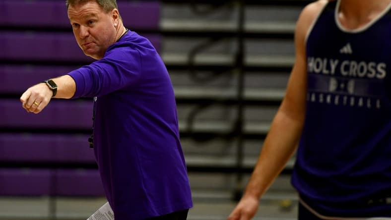Holy Cross men's basketball coach Dave Paulsen instructs during a recent practice.