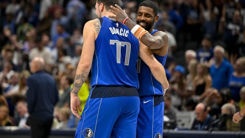 Nov 5, 2023; Dallas, Texas, USA; Dallas Mavericks guard Kyrie Irving (11) hugs guard Luka Doncic (77) during the second half against the Charlotte Hornets at the American Airlines Center. Mandatory Credit: Jerome Miron-USA TODAY Sports