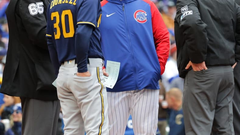 Chicago Cubs manager David Ross and Milwaukee Brewers manager Craig Counsell (30) meet before their game Thursday, April , 2022 at Wrigley Field in Chicago, Ill.MARK HOFFMAN/MILWAUKEE JOURNAL SENTINEL