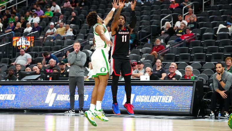 Nov 6, 2023; Las Vegas, Nevada, USA; Georgia Bulldogs guard Justin Hill (11) shoots against Oregon Ducks guard Jadrian Tracey (22) during the second half at T-Mobile Arena. Mandatory Credit: Stephen R. Sylvanie-USA TODAY Sports