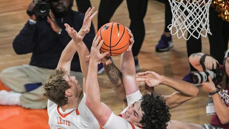 Clemson junior forward Ian Schieffelin (4) rebounds near teammate graduate Bas Leyte (33) during the first half at Littlejohn Coliseum in Clemson, S.C. Monday, November 6, 2023.