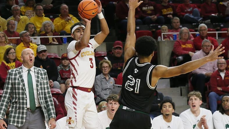Iowa State Cyclones guard Tamin Lipsey (3) takes a three-point shot over Green Bay Phoenix guard Noah Reynolds (21)during the first half at Hilton Coliseum on Monday, Nov. 6, 2023, in Ames, Iowa.