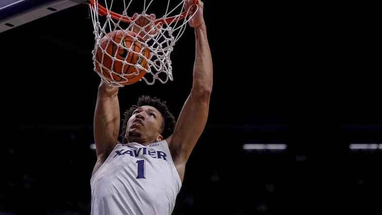 Nov 6, 2023; Cincinnati, Ohio, USA; Xavier Musketeers guard Desmond Claude (1) dunks on the Robert Morris Colonials in the first half at Cintas Center. Mandatory Credit: Katie Stratman-USA TODAY Sports