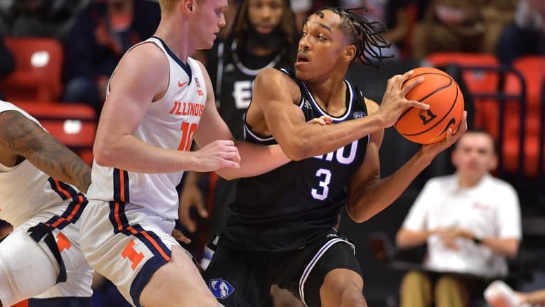 Nov 6, 2023; Champaign, Illinois, USA;  Illinois Fighting Illini guard Luke Goode (10) reaches for the ball controlled by Eastern Illinois Panthers guard Nakyel Shelton (3) during the first half at State Farm Center. Mandatory Credit: Ron Johnson-USA TODAY Sports