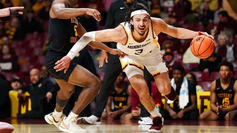 Nov 6, 2023; Minneapolis, Minnesota, USA; Minnesota Golden Gophers forward Dawson Garcia (3) drives around Bethune-Cookman Wildcats guard Damani McEntire (5) during the first half at Williams Arena. Mandatory Credit: Matt Krohn-USA TODAY Sports
