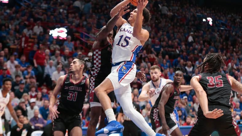 Kansas graduate senior guard Kevin McCullar Jr. (15) drives the ball against North Carolina Central during the first half of Monday's game inside Allen Fieldhouse.
