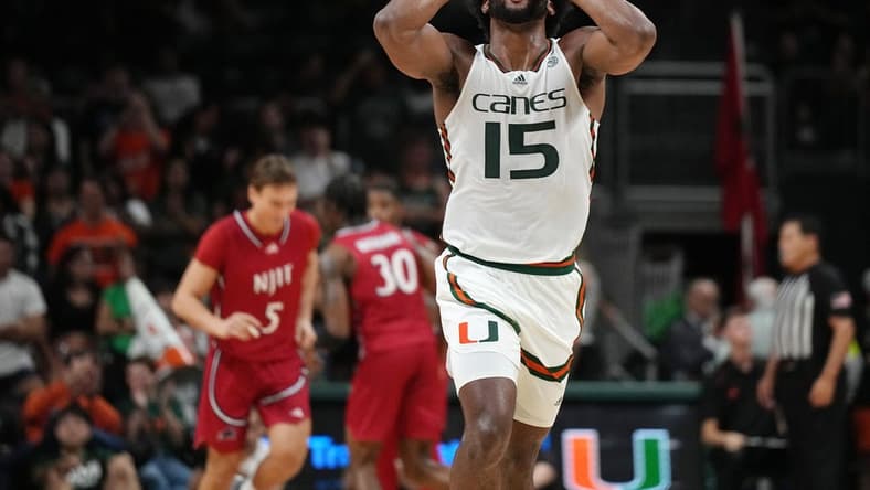 Nov 6, 2023; Coral Gables, Florida, USA; Miami (Fl) Hurricanes forward Norchad Omier (15) reacts to his team scoring in transition against the N.J.I.T Highlanders  in the second half at Watsco Center. Mandatory Credit: Jim Rassol-USA TODAY Sports