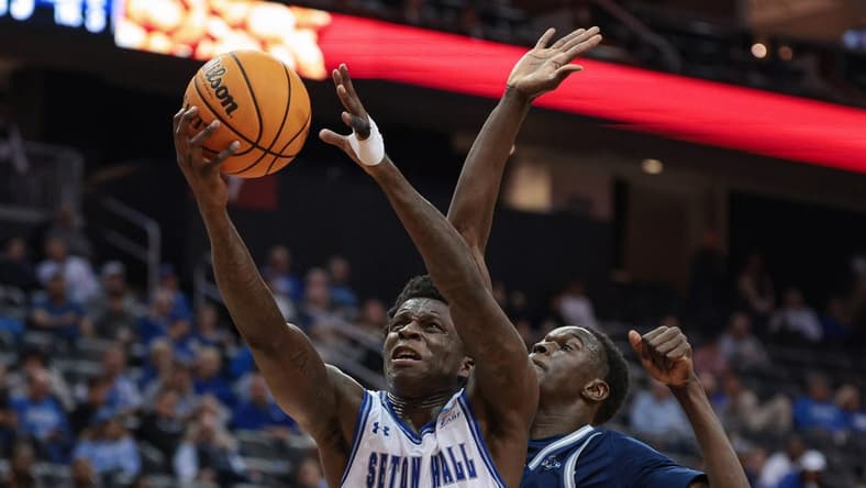 Nov 6, 2023; Newark, New Jersey, USA; Seton Hall Pirates guard Kadary Richmond (1) drives to the basket as St. Peter's Peacocks forward Mouhamed Sow (35) defends during the second half at Prudential Center. Mandatory Credit: Vincent Carchietta-USA TODAY Sports