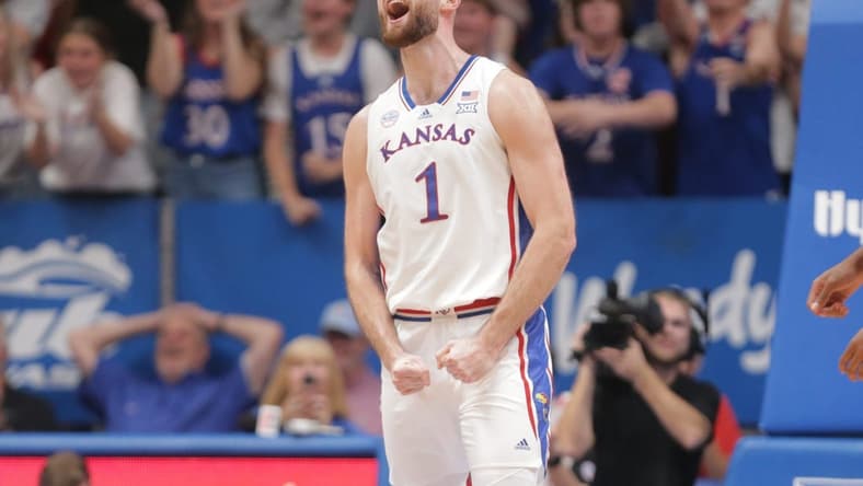Kansas senior center Hunter Dickinson (1) reacts after sinking a three in the first half of Monday's game against North Carolina Central inside Allen Fieldhouse.